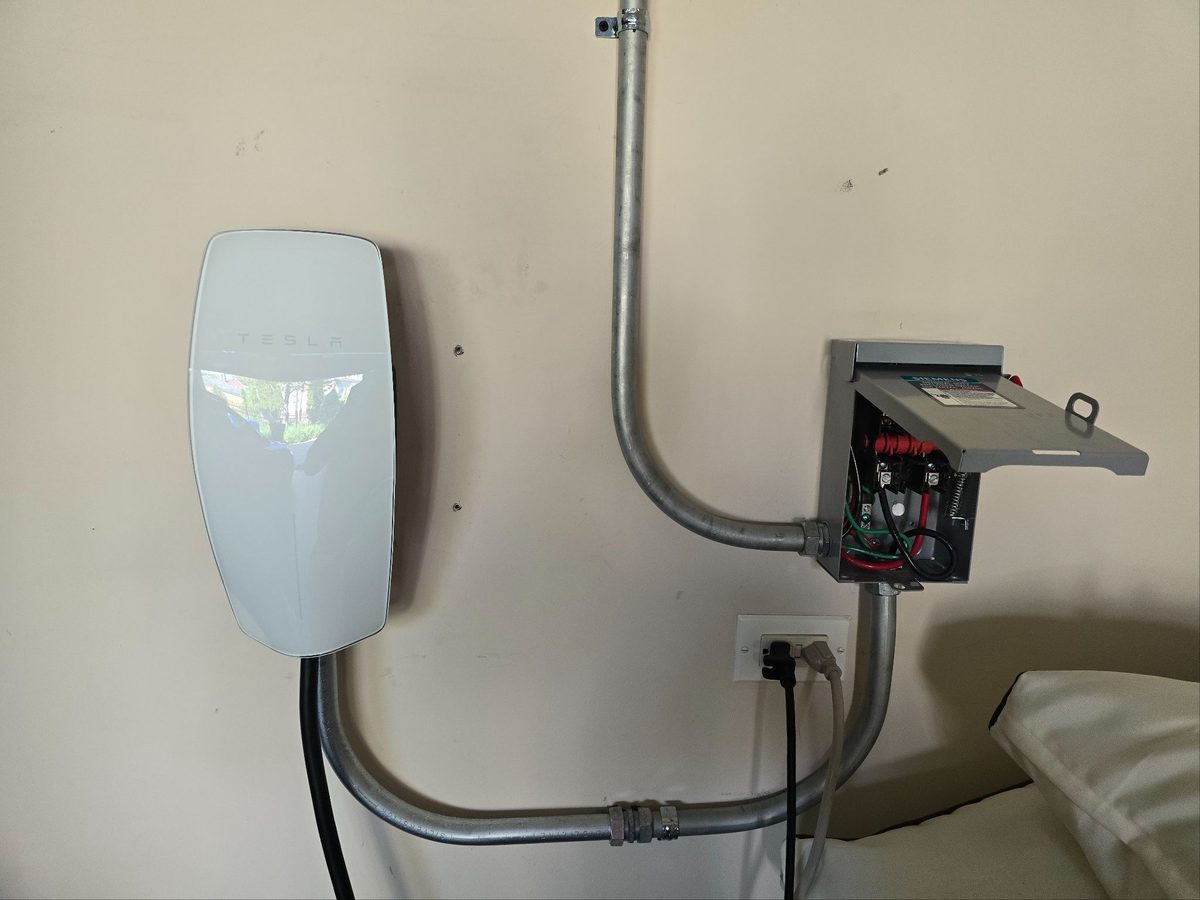 Tesla Wall Connector installed with a dedicated disconnect and clean conduit